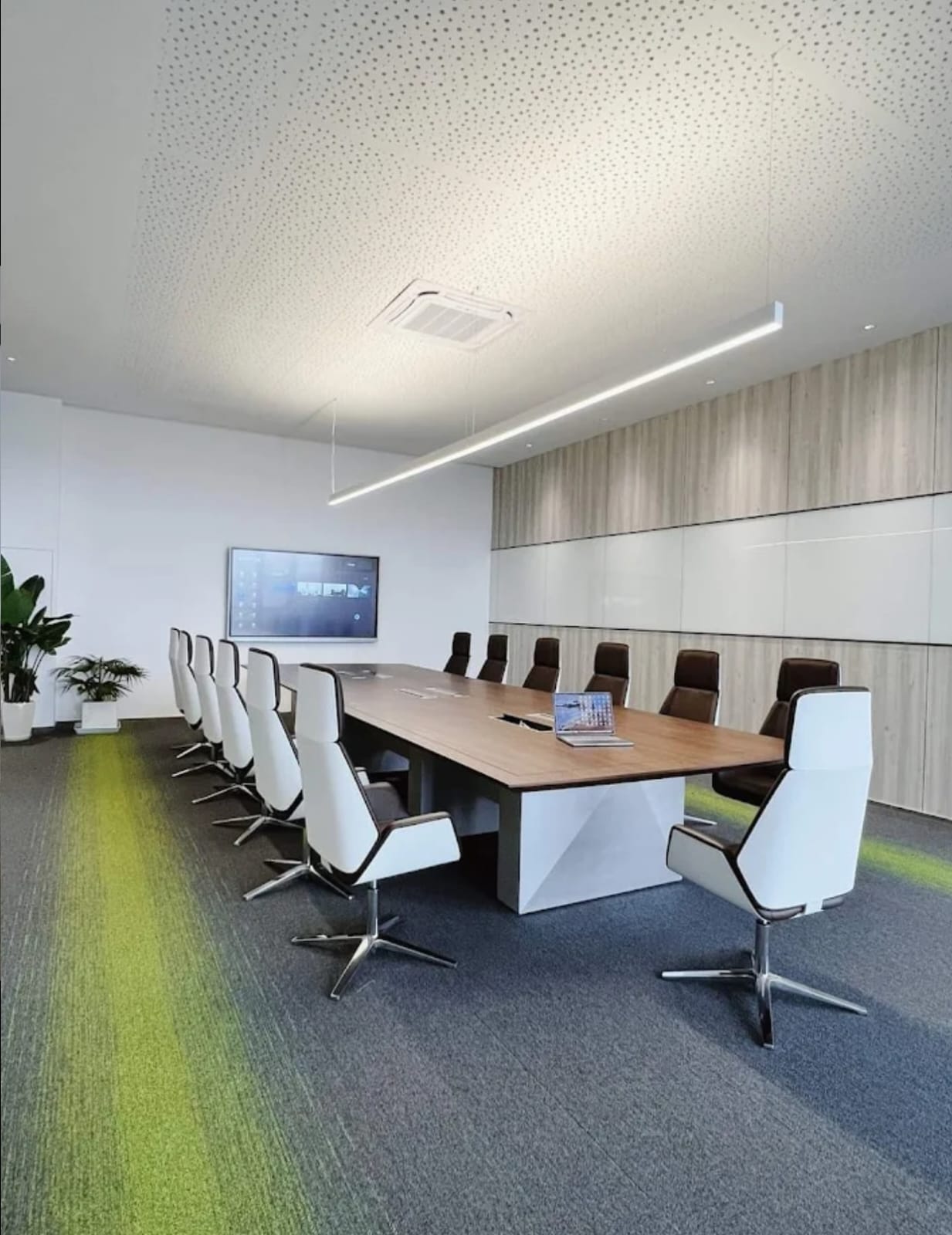 Conference room with white high-back chairs